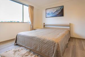 a bedroom with a bed and a large window at Hin Nan Hua Hin RELAX in Hua Hin +17 photos