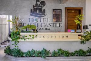 a hotel lobby with a sign that reads hotel brazil castle canary bay at Hotel Beach Castle in Arugam Bay