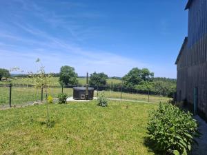 a garden with a stove in the middle of a field at Faugere in Bussières
