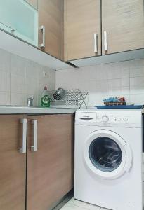 a white washer and dryer in a kitchen at Cosy apartment in Perea