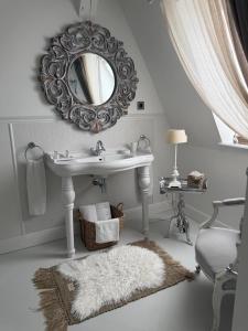 a white bathroom with a sink and a mirror at Villa Celine in Mielno +73 photos