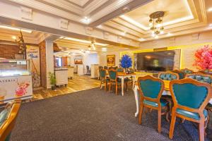 a dining room with a table and chairs at Andalouse Otel in Trabzon