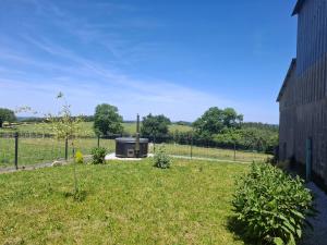 a garden with a stove in the middle of a field at Faugere in Bussières