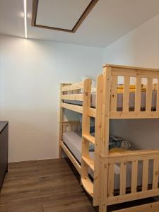 two sets of bunk beds in a room at Stadlchalet in Ried im Oberinntal
