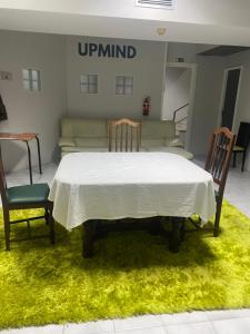 a room with a table and two chairs and a couch at Hostel da Maria - Porto in Vila Nova de Gaia