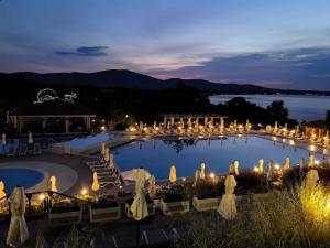a view of a pool at night with lights at Sea view and more in Bŭnzareto