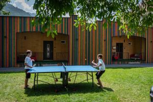 two children playing ping pong on a ping pong table at Stadlchalet in Ried im Oberinntal