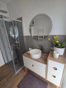 a bathroom with a sink and a shower at In Blu Santo Ospedale in Padova