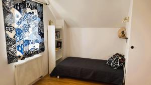 a small bedroom with a bed in a room at Apartment ZARJA in Dobrnič