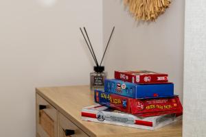 a stack of books sitting on top of a table at TheaHouse in Pythagoreio
