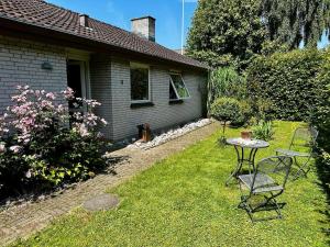 a table and chairs in the yard of a house at Chatka in Tappernøje