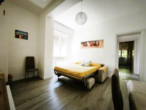 a bedroom with a bed and a large window at La Casina di Orsolina - Check-in Flessibile in Livorno +22 photos