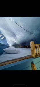 a bed in a tent on a boat at Chadir yurd glamp in İsmayıllı +117 photos
