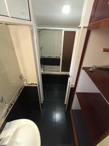 a small bathroom with a toilet and a sink at Dotty's House in Gaula +41 photos