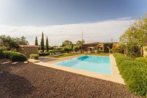 a swimming pool in a yard with a house at New to the market - 4BR Farmhouse with Pool by SF Homes in Siġġiewi
