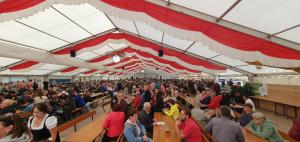 a large crowd of people sitting in a tent at FeWo Altstadt Herrieden in Herrieden +117 photos