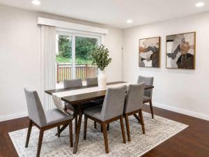 a dining room with a table and chairs at Bellevue Pet friendly Home Fenced Yard in Bellevue