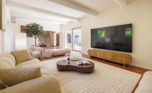 a living room with a large flat screen tv at villa la Sine in Vence
