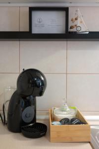 a mixer sitting on a counter next to a wooden box at Captain's Quarters - with Terrace and Parking near Lake Balaton in Keszthely +31 photos