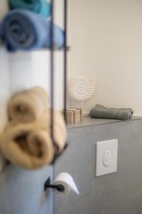 a counter top with a mirror and some objects at Reload Apartments - FeWo2 im Remmeker Feld in Bad Arolsen