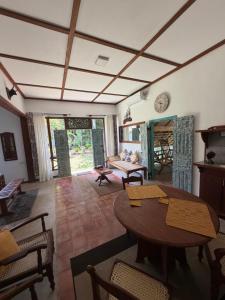 a living room with a table and chairs at Lobo's Retreat in Kurunegala
