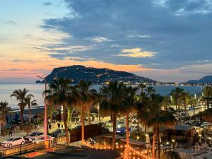 a view of a city with palm trees and the ocean at SA Apartments! Beachfront Apartments in Oba in Alanya