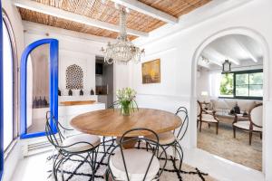 a dining room with a table and chairs at Dar Almaz in Mijas +22 photos
