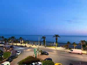 a city with cars parked on a street next to the ocean at SA Apartments! Beachfront Apartments in Oba in Alanya