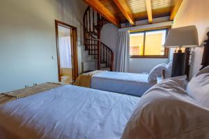 a bedroom with two beds and a window at Villa Fernandos in Praia de Mira +84 photos