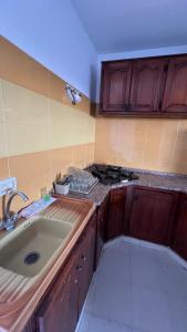 a kitchen with a sink and a counter top at House in Djerba s1 in Midoun