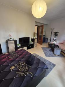 a bedroom with a bed with a dragon design on it at Modern & Quiet City Apartment in Hannover