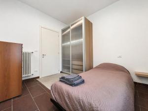 a bedroom with a bed and a closet at Ground floor house in Castel Bolognese