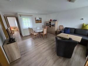 a living room with a couch and a table at Ferienhaus Parnet in Neudorf
