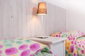 A bed or beds in a room at La Casa di Linda