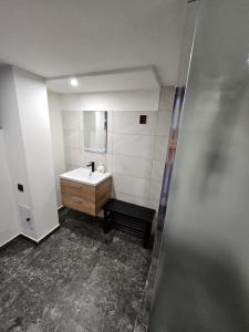 a bathroom with a sink and a mirror at Rodinná chata Alexa, Beskydy in Prostřední Bečva +24 photos