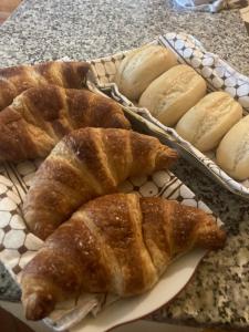 a plate of bread and pastries on a table at Villa Fontana 2 in Capannori