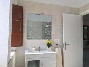 a kitchen with a sink and a chalkboard on the wall at Casa Piedad in Allence +19 photos