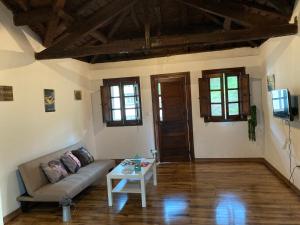 a living room with a couch and a table at Casa Piedad in Allence