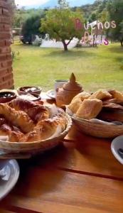 a table with two baskets of food on it at Lo de Chimila in San Javier