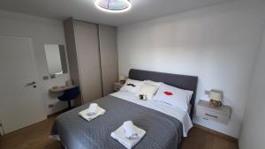 a bedroom with a bed with towels on it at Villa Stanić in Omiš +46 photos