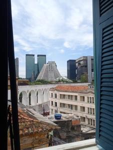 a view from a window of a city with buildings at Boêmia carioca in Rio de Janeiro