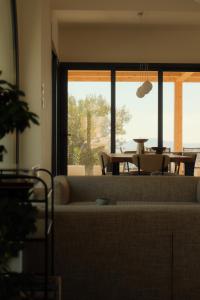 a living room with a couch and a table at Nafura in Raffadali