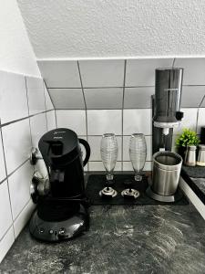 a coffee maker on a counter in a kitchen at STAY - City W32 in Friedrichshafen