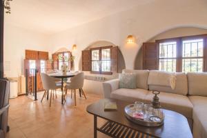 a living room with a couch and a table at Casa de Suenos in Comares