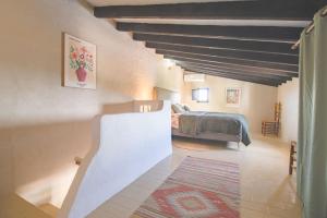 a bedroom with a bed in a room at Casa de Suenos in Comares +37 photos