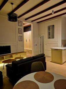 a living room with a couch and a table at Ahar in Sarajevo