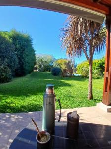 a thermos sitting on a table with a bowl of food at Casa Las Tardes, Roldan in San Lorenzo