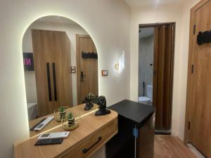 a bathroom with a counter with a sink and a mirror at Latina City in Cairo