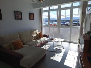 a living room with a couch and a table at VT Varadero in Fisterra