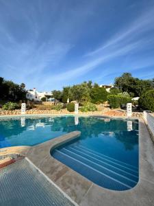 a large swimming pool with blue water at Villa Valentina-Sunny 2 Bedroom House with Pool in Carvoeiro